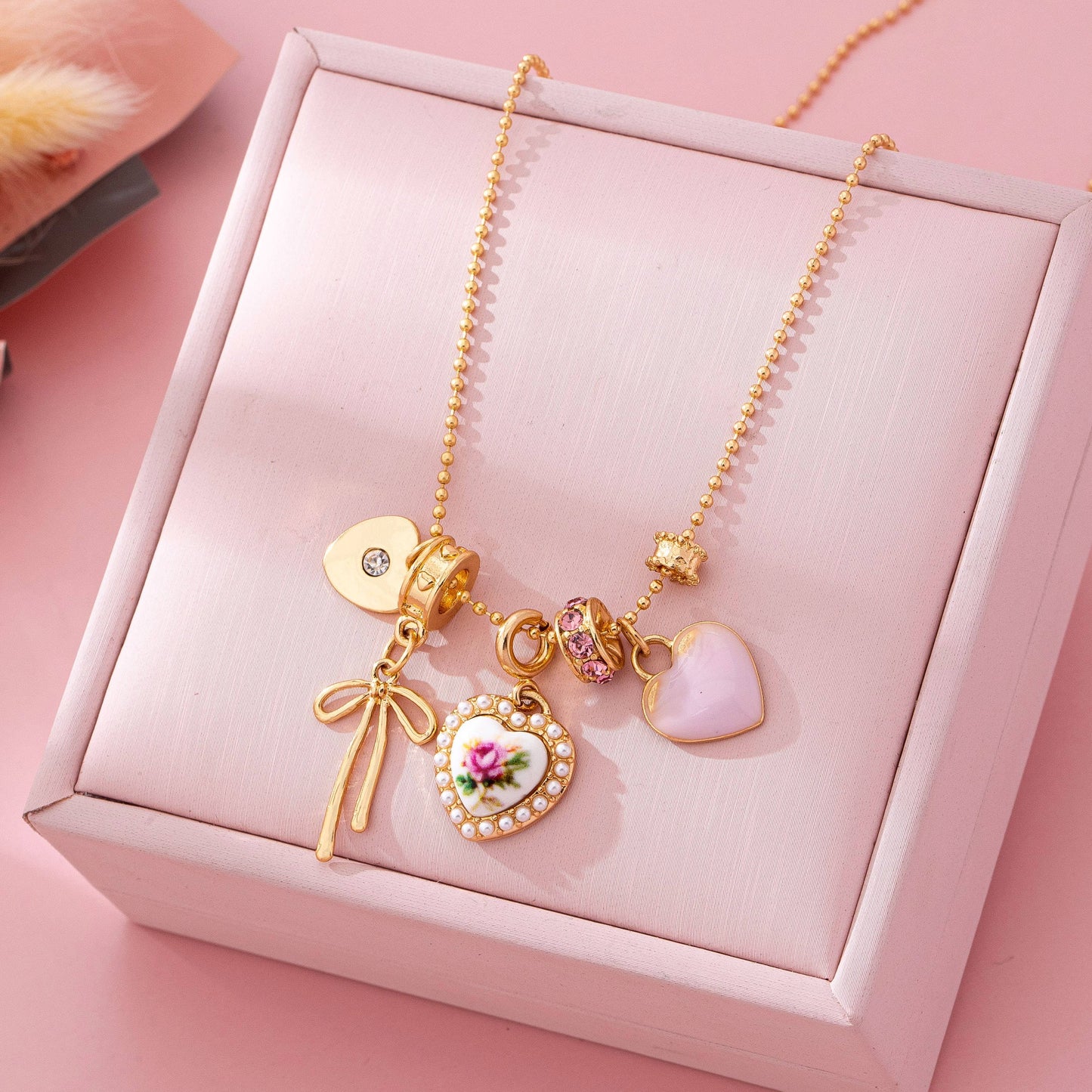 Multi Charm Porcelain Bow Ball Chain Necklace